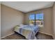 Bedroom features a large window with neighborhood views and carpet, creating a cozy and inviting atmosphere at 12720 W Cantenia Rd, Avondale, AZ 85392