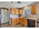 Kitchen featuring wooden cabinets, laminate countertops, stainless steel sink and appliances at 12720 W Cantenia Rd, Avondale, AZ 85392