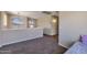 Spacious loft area with neutral walls and carpet, perfect for a relaxing retreat or additional living space at 12720 W Cantenia Rd, Avondale, AZ 85392