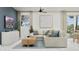 Comfortable living room featuring a plush sectional sofa, modern decor, and plenty of natural light at 1332 W Ridge Rd, Apache Junction, AZ 85120