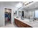 This bathroom includes a double vanity, walk-in closet, and shower at 1359 E 12Th St, Casa Grande, AZ 85122