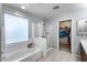 Bright bathroom with a tub, shower, and walk-in closet at 1359 E 12Th St, Casa Grande, AZ 85122