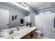 Bathroom with a spacious countertop, large mirror, and a shower-tub combination at 1359 E 12Th St, Casa Grande, AZ 85122