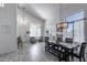 Open dining area with shiplap accent wall, modern lighting, and convenient access to the living room at 1359 E 12Th St, Casa Grande, AZ 85122