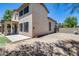 Back exterior of the house with large screened windows, concrete patio, and gravel area at 1359 E 12Th St, Casa Grande, AZ 85122