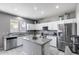 Bright kitchen featuring granite countertops, stainless steel appliances, and ample cabinet space at 1359 E 12Th St, Casa Grande, AZ 85122