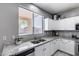 Kitchen featuring granite countertops, a stainless steel sink, and a view of the patio at 1359 E 12Th St, Casa Grande, AZ 85122