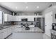 Bright kitchen featuring white cabinetry, stainless steel appliances, and stone countertops at 1359 E 12Th St, Casa Grande, AZ 85122