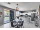 Modern kitchen with stainless appliances and granite island, next to dining area with outdoor access at 1359 E 12Th St, Casa Grande, AZ 85122