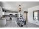 Eat-in kitchen featuring a table with seating and white cabinets with stone countertops at 1359 E 12Th St, Casa Grande, AZ 85122