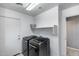 Clean, well-lit laundry area featuring modern front-load washer and dryer at 1359 E 12Th St, Casa Grande, AZ 85122