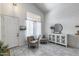 Cozy living area with white shiplap wall, tile floor, seating, and large window at 1359 E 12Th St, Casa Grande, AZ 85122