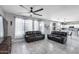 Inviting living room with tile floors, comfortable seating, and large windows offering plenty of natural light at 1359 E 12Th St, Casa Grande, AZ 85122