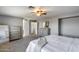 Main bedroom with a ceiling fan and large windows at 1359 E 12Th St, Casa Grande, AZ 85122