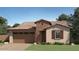 Charming single-story home featuring a tile roof, stucco siding, and a two-car garage at 1378 W J Waltz Way, Apache Junction, AZ 85120