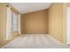 Bright, empty bedroom features large window and neutral paint, ready for personalization at 1403 W Goldfinch Way, Chandler, AZ 85286