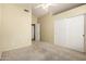 Spacious bedroom featuring a ceiling fan, closet and neutral carpeting at 1403 W Goldfinch Way, Chandler, AZ 85286