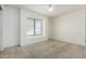Clean and spacious bedroom with carpet, window with blinds and ceiling fan at 1403 W Goldfinch Way, Chandler, AZ 85286