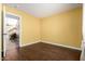 This bedroom has hardwood floors and a view of the stairway through the entry at 1403 W Goldfinch Way, Chandler, AZ 85286