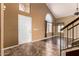 Bright foyer with tile flooring, high ceilings, and staircase at 1403 W Goldfinch Way, Chandler, AZ 85286