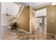 Spacious foyer with tile flooring, staircase, and views into other rooms at 1403 W Goldfinch Way, Chandler, AZ 85286