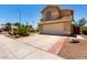 Lovely home with a two-car garage, desert landscaping, and a tile roof at 1403 W Goldfinch Way, Chandler, AZ 85286