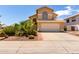Charming home featuring a two-car garage, desert landscaping, and a tile roof in a sunny neighborhood at 1403 W Goldfinch Way, Chandler, AZ 85286