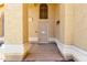Inviting front porch with security door, stucco pillars and accent lighting at 1403 W Goldfinch Way, Chandler, AZ 85286