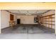 Spacious two-car garage with shelving and storage space at 1403 W Goldfinch Way, Chandler, AZ 85286