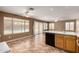 Eat-in kitchen features tiled floors and a breakfast bar overlooking the living area and backyard pool at 1403 W Goldfinch Way, Chandler, AZ 85286