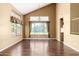 Bright living room boasting tall windows and hardwood floors at 1403 W Goldfinch Way, Chandler, AZ 85286
