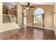 Living room with soaring ceilings, large windows, and a staircase at 1403 W Goldfinch Way, Chandler, AZ 85286