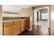 This loft features a set of built-in storage cabinets and a view into the bedroom at 1403 W Goldfinch Way, Chandler, AZ 85286