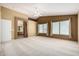 Spacious main bedroom with carpet, vaulted ceiling, and ensuite bathroom at 1403 W Goldfinch Way, Chandler, AZ 85286