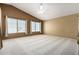 Large main bedroom with vaulted ceilings, plush carpet, and multiple windows for natural light at 1403 W Goldfinch Way, Chandler, AZ 85286