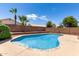 Sparkling pool with desert landscaping and block wall providing privacy at 1403 W Goldfinch Way, Chandler, AZ 85286