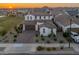 Aerial view of a beautiful suburban neighborhood with sunset at 14274 W Sand Hills Rd, Surprise, AZ 85387