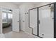 Modern bathroom features a sleek, glass-enclosed shower with a built-in seat at 14274 W Sand Hills Rd, Surprise, AZ 85387