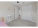 Comfortable bedroom featuring plush carpet, neutral paint, and sliding door access to storage at 14274 W Sand Hills Rd, Surprise, AZ 85387