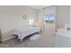 Cozy bedroom featuring a twin bed, plush rug, and bright natural light from a window at 14274 W Sand Hills Rd, Surprise, AZ 85387