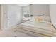 Cozy bedroom featuring a full bed, desk, white closet, and natural light from the window at 14274 W Sand Hills Rd, Surprise, AZ 85387