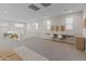 Large bonus room with a built-in desk and a cozy seating area at 14274 W Sand Hills Rd, Surprise, AZ 85387
