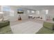 Expansive bonus room featuring lots of natural light, fun seating and play areas at 14274 W Sand Hills Rd, Surprise, AZ 85387