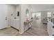 Inviting entryway with a console table and storage cabinet, leading into the dining and living spaces at 14274 W Sand Hills Rd, Surprise, AZ 85387