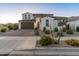 Beautiful home with brick driveway, two-car garage, and manicured landscaping at 14274 W Sand Hills Rd, Surprise, AZ 85387