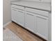 Close up of the laundry room showing white cabinets, light countertops and tile floors at 14274 W Sand Hills Rd, Surprise, AZ 85387