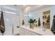 Clean, modern bathroom with double sinks, spacious shower, and a walk-in closet at 1482 W Ridge Rd, Apache Junction, AZ 85120
