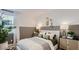 Stylish bedroom with paneled accent wall, designer decor, and soft natural light creating a cozy ambiance at 1482 W Ridge Rd, Apache Junction, AZ 85120