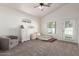 Spacious carpeted bedroom with vaulted ceilings, natural light, and neutral decor at 15034 N 30Th St, Phoenix, AZ 85032