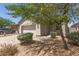 Inviting single-Gathering home featuring a two-car garage, desert landscaping, and mature trees for shade at 15034 N 30Th St, Phoenix, AZ 85032